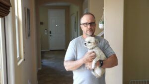 Man Holding A Puppy