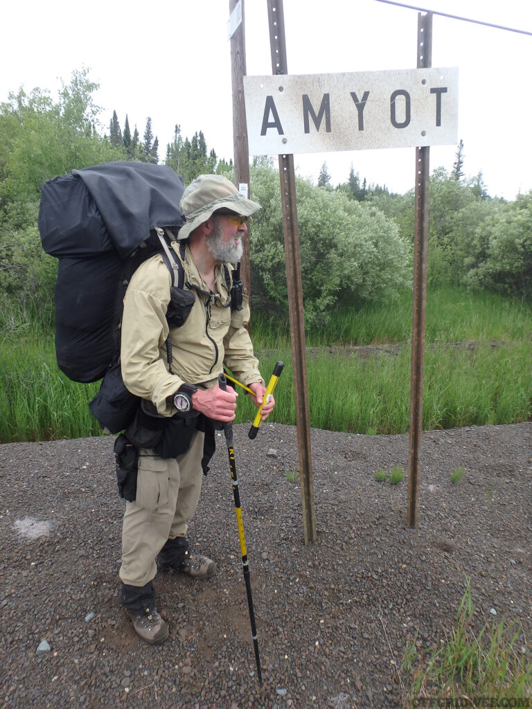 Michael Neiger standing in front of a sign that says 