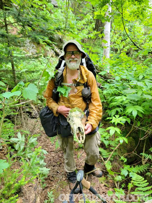 Michael Neiger holding an animal skull.