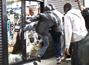 looters kicking in window