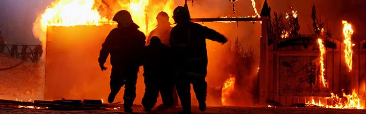 Firemen Rescuing Someone From House Fire