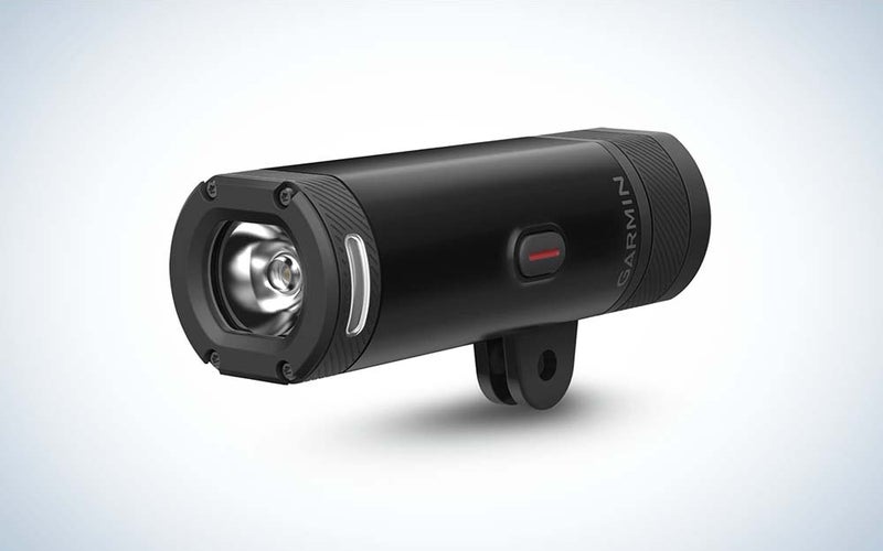 A cyndrical black Garmin Varia UT Smart Headlight against a plain background.