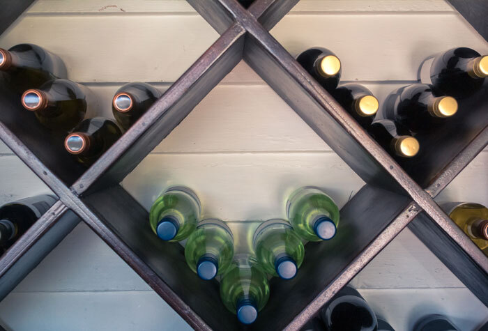 Bottles of wine on a shelf.