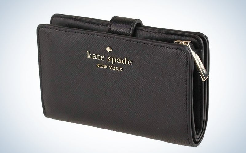 A black Kate Spade wallet on a blue and white background