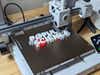 Bambu Labs A1 3D Printer with a print in-progress on its bed