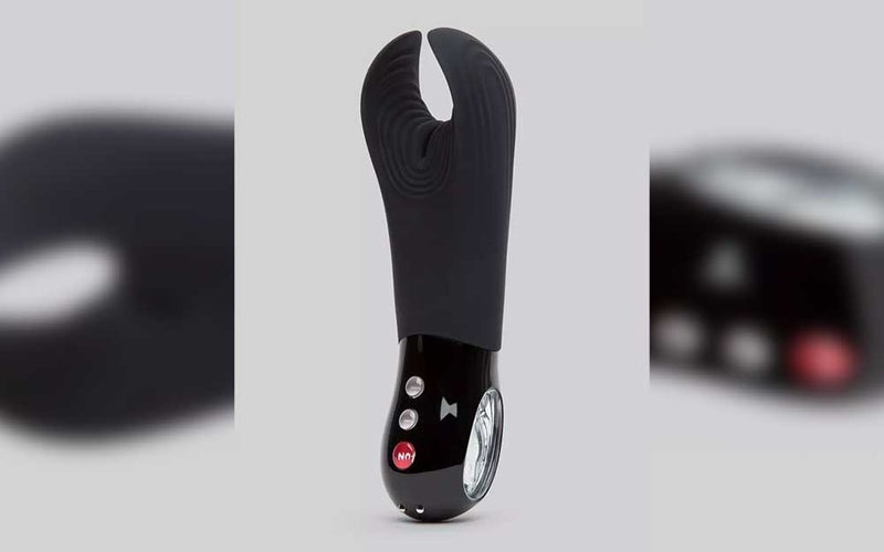 A black Fun Factory Manta sex toy for couples on a gray background