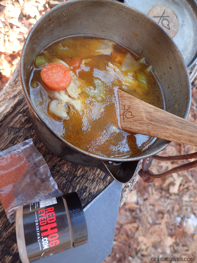 Photo of camp food stewing in a pot.