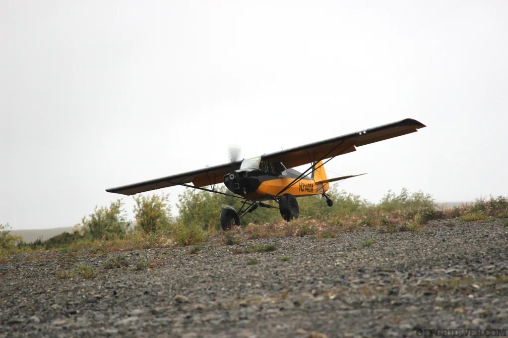 Photo of a bush plane on a rocky runway.