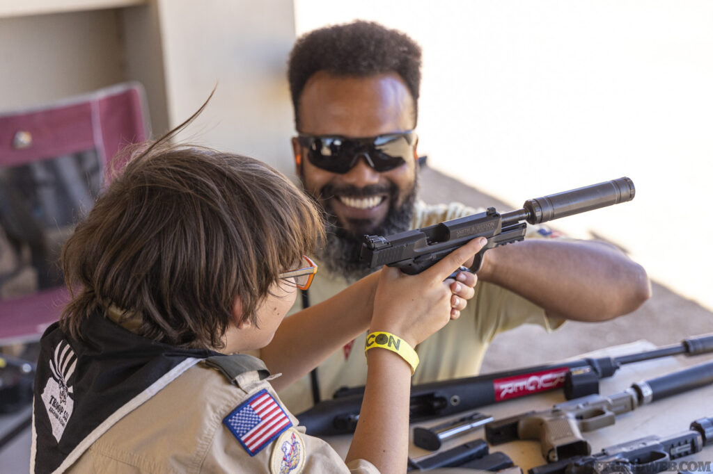 A Boy Scout from Arizona Troop 531 learns about firearm safety.