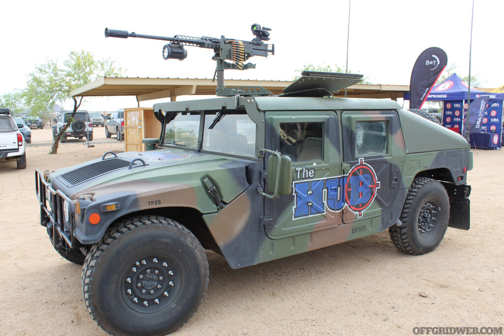 A HMMWV with a suppressed M2 .50cal mounted to the turret.
